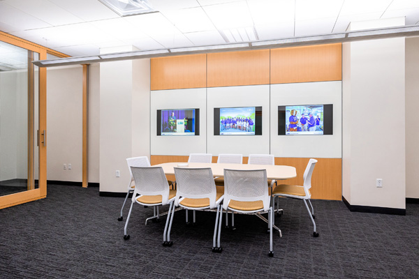 Confernece table and screens in the Sales Lab