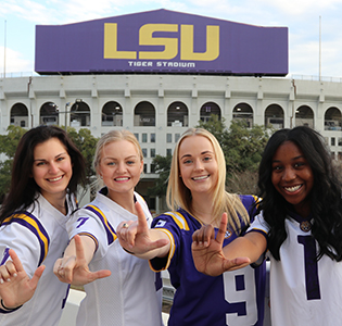 ambassadors in front of stadium