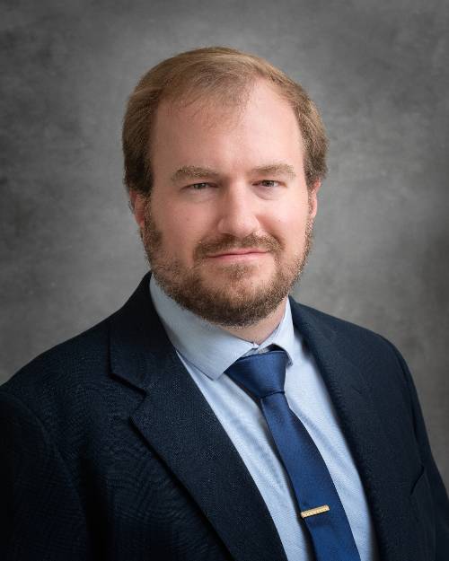 Headshot of panelist Christopher Schneider