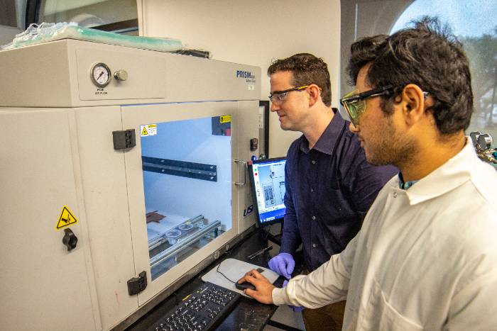 Arges and Romagnoli looking at labratory tools