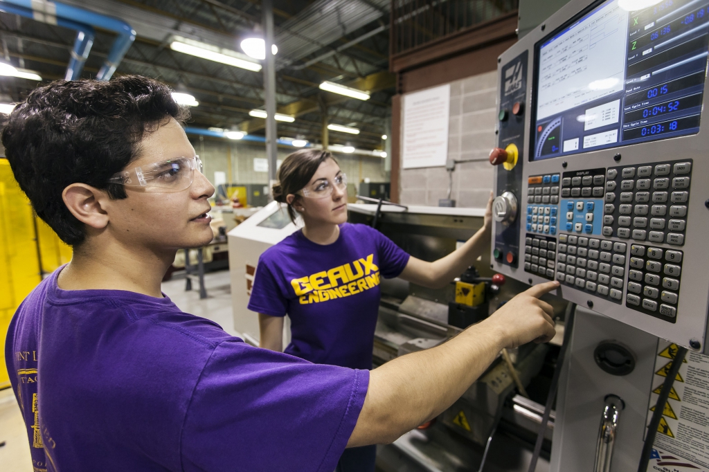 two IE students pressing buttons