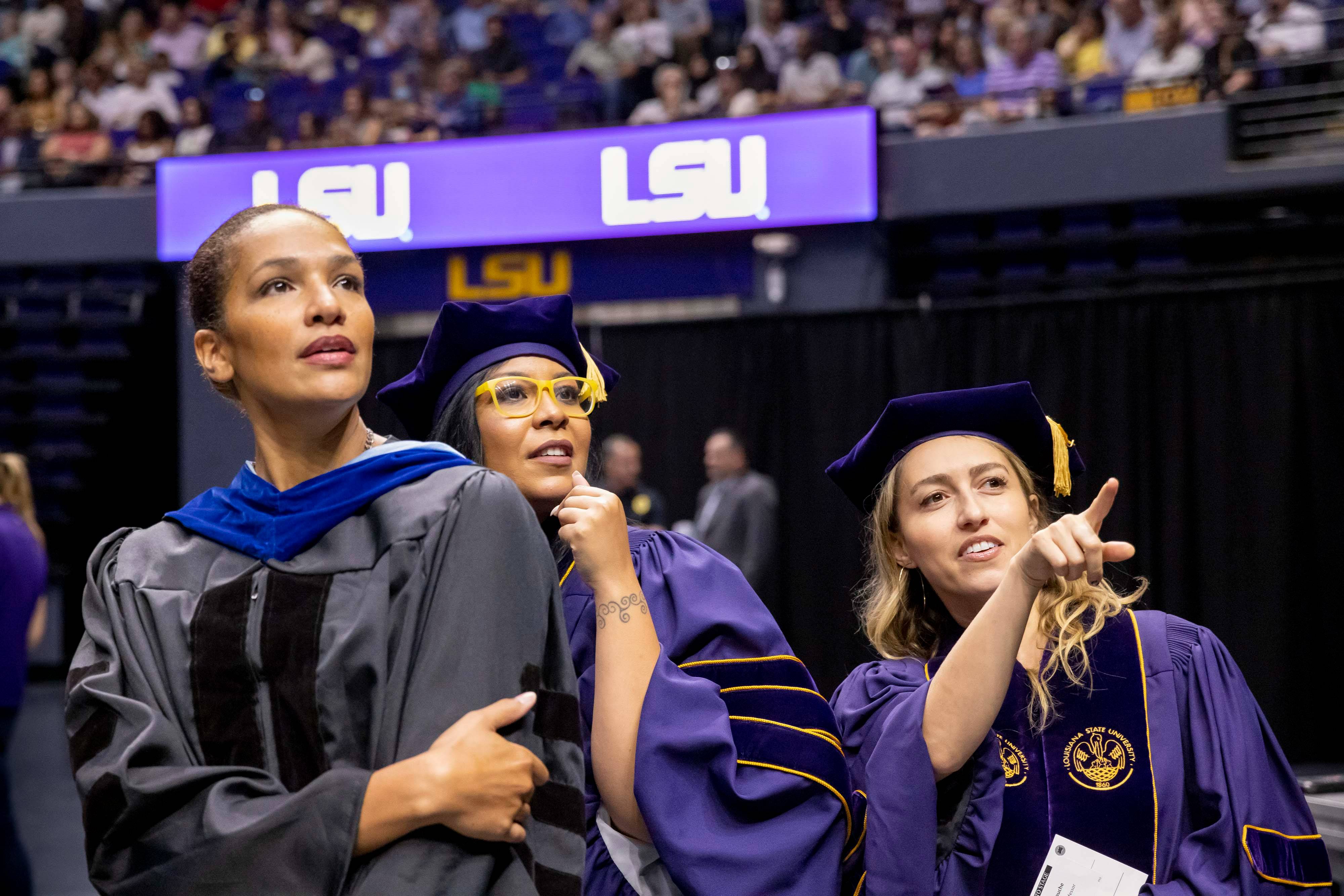 Three doctoral graduates