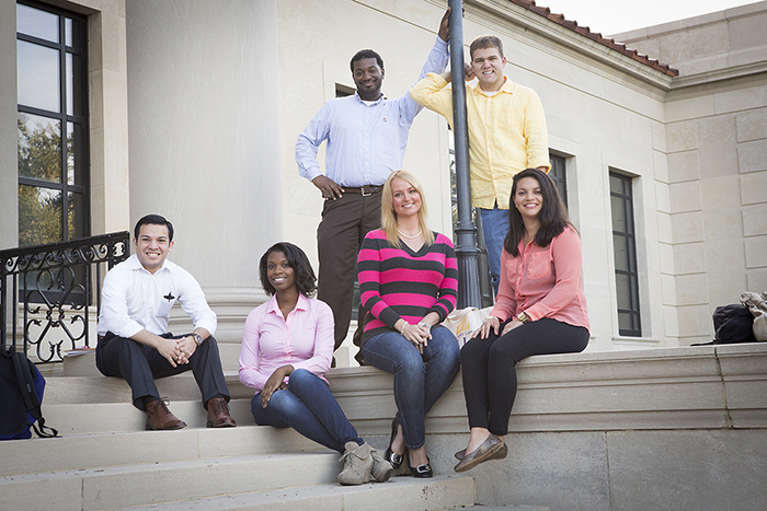 LSU Law students seated on steps outside of the Law Center.