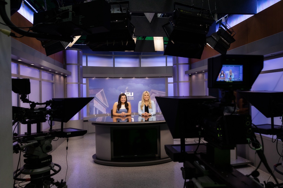 Students sitting at TigerTV desk