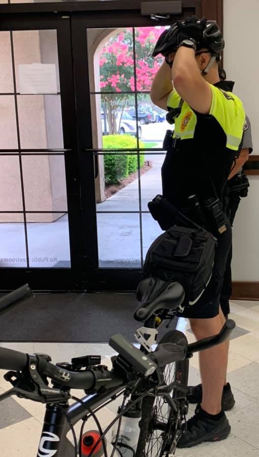 officer wearing bicycle safety equipment