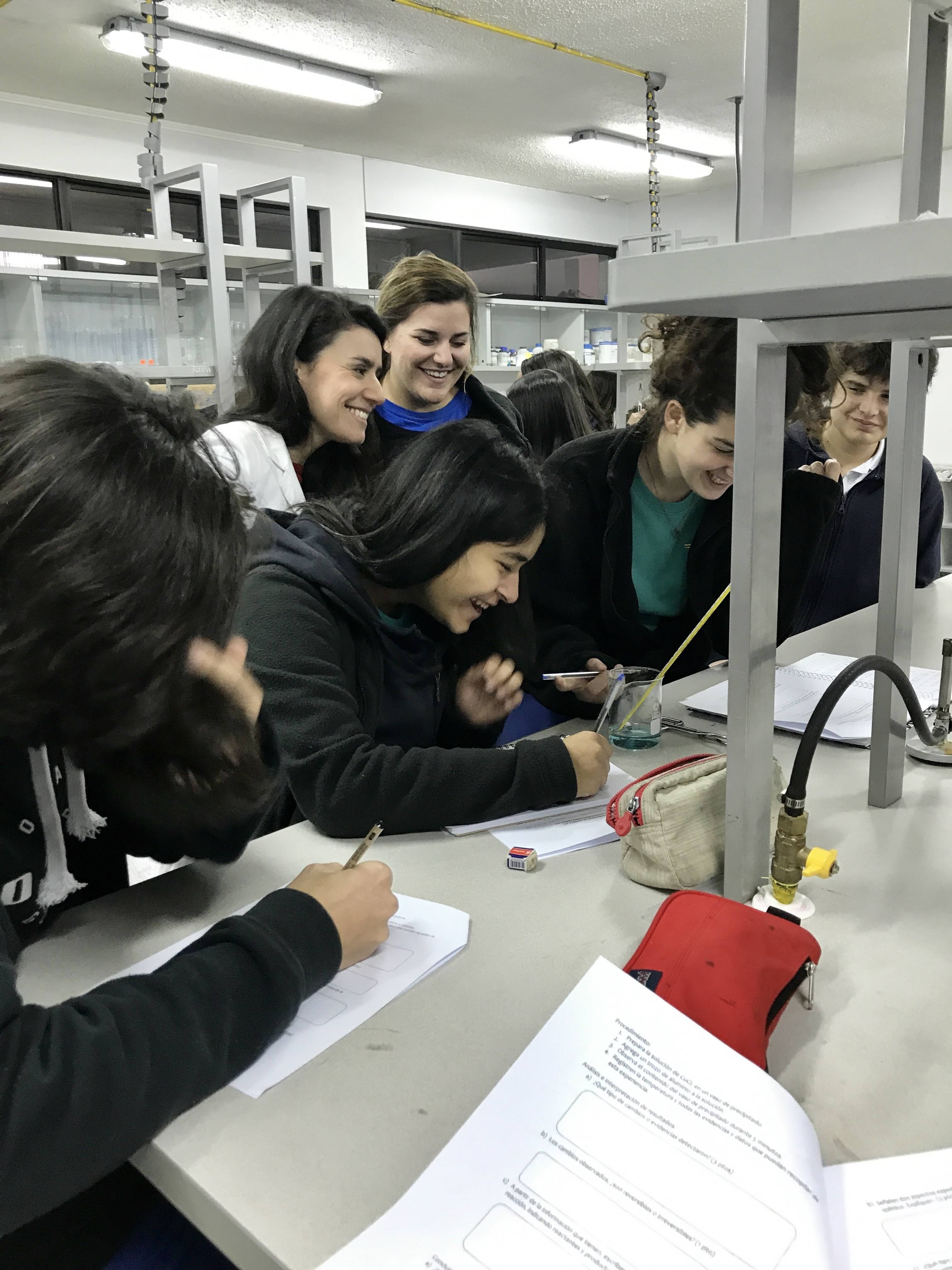 Teacher and students in a chemistry lab