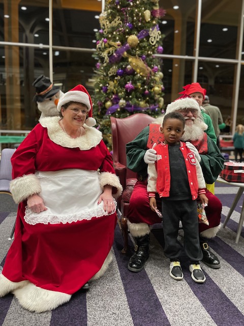 Santa Claus and Mrs. Claus with children